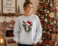 Western Christmas Cow Skull Sweatshirt – Santa Hat, Christmas Lights & Rustic Holiday Graphic Crewneck